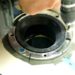 secure toilet flange to concrete floor