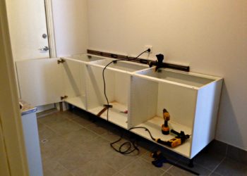 fitting kitchen cabinets to uneven walls