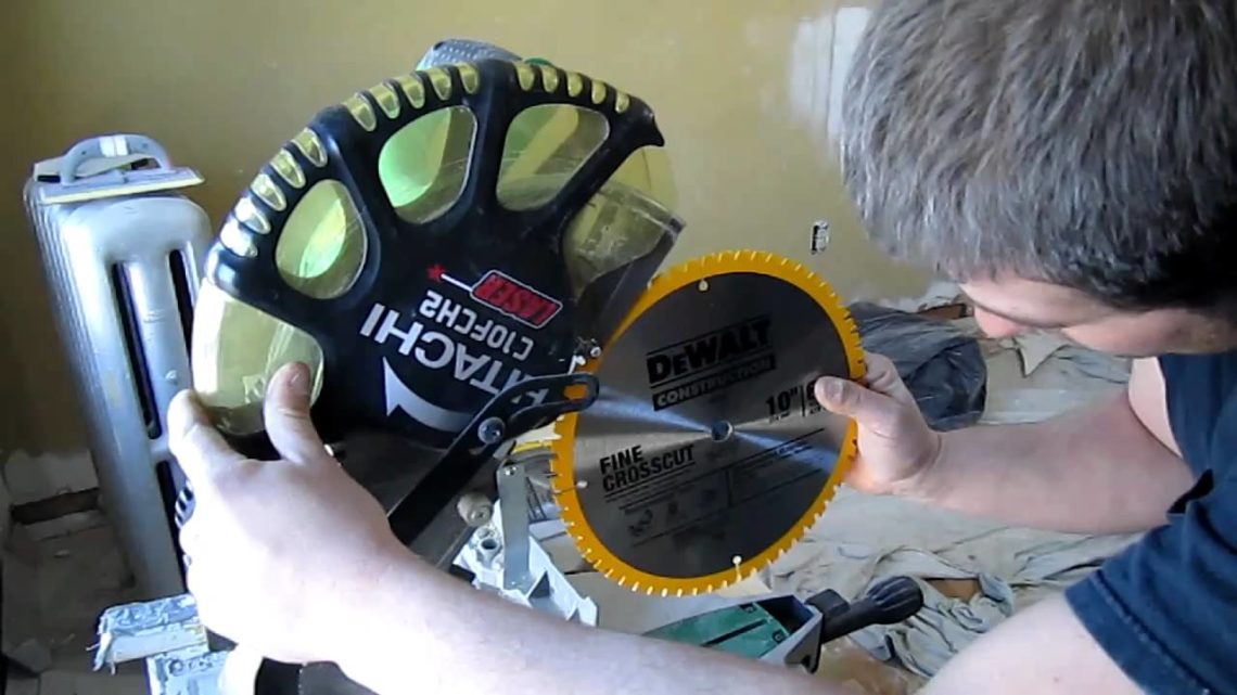 How do you lift a DeWalt miter saw?
