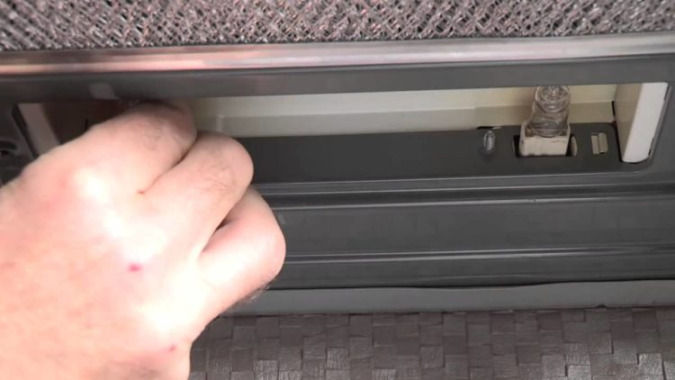 How do I change the lightbulb in my NuTone range hood?