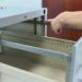 How does the locking mechanism on a filing cabinet work?