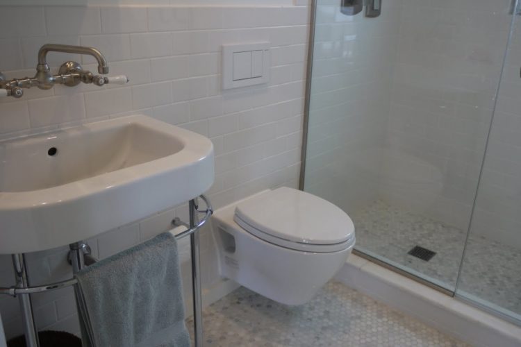 How do you replace a wall mounted toilet?