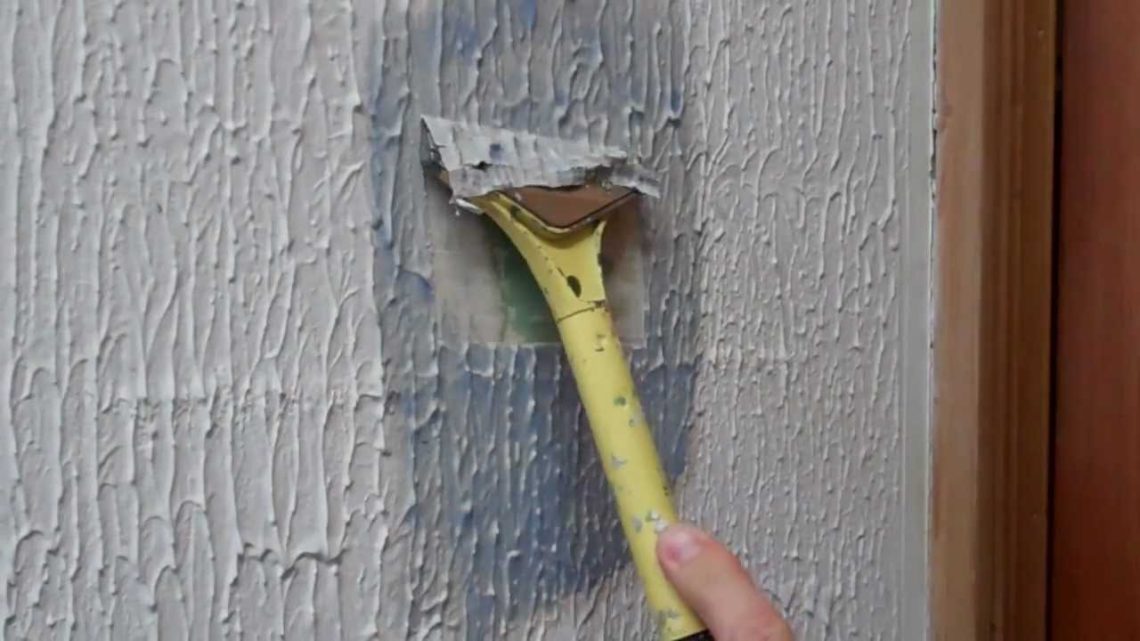 How do you remove textured paint from plaster walls?