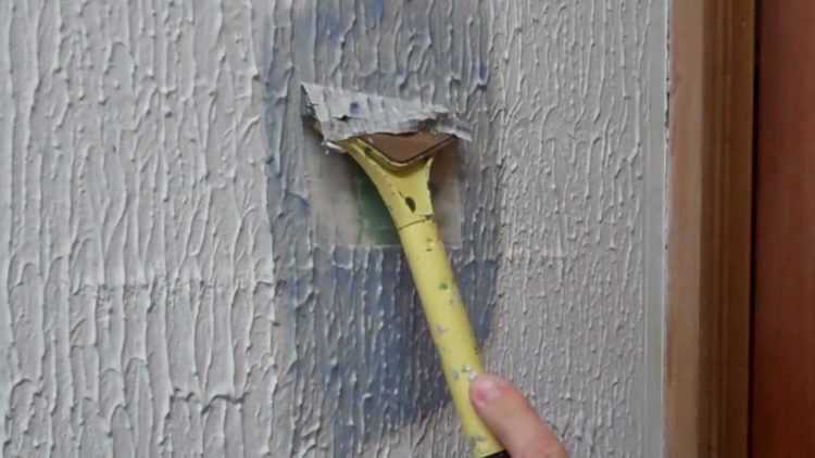 How do you remove old textured paint?