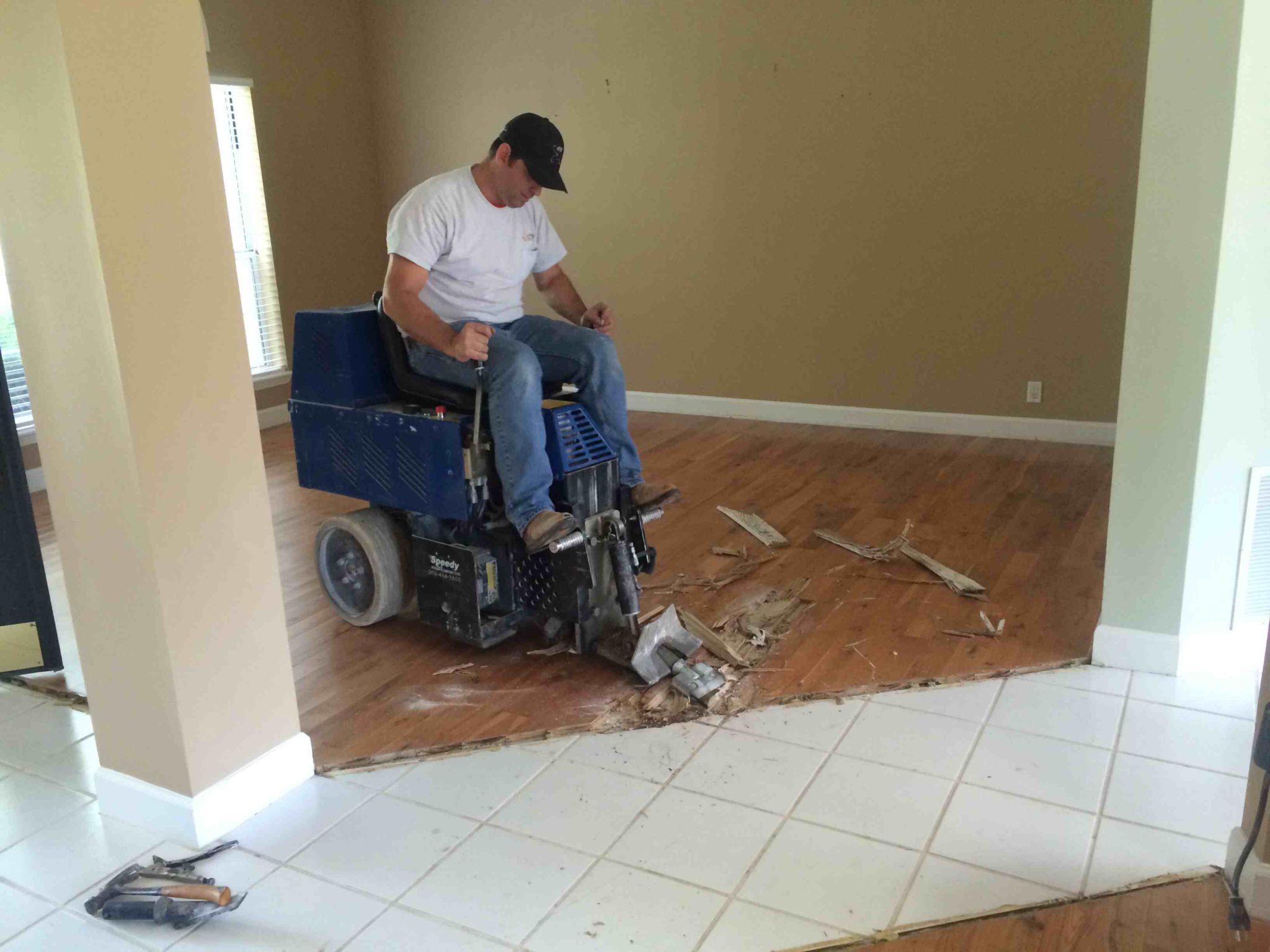 How do you remove tile from a concrete slab?