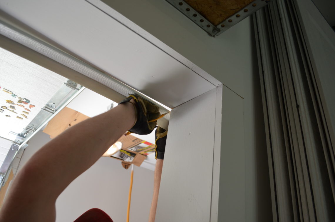 How do you replace the rubber on the bottom of a garage door?