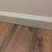 How do you fix a gap between carpet and baseboards?