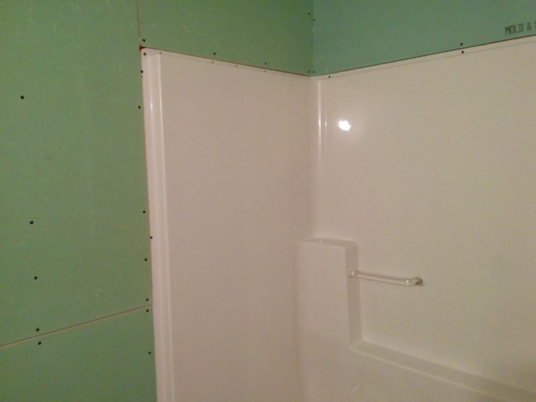 How do you seal shower drywall?