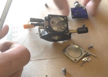 How do you clean the carburetor on a Ryobi blower?