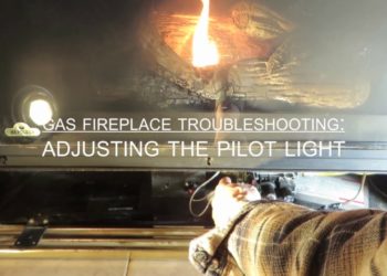 How do you adjust the flame on a Heatilator fireplace?