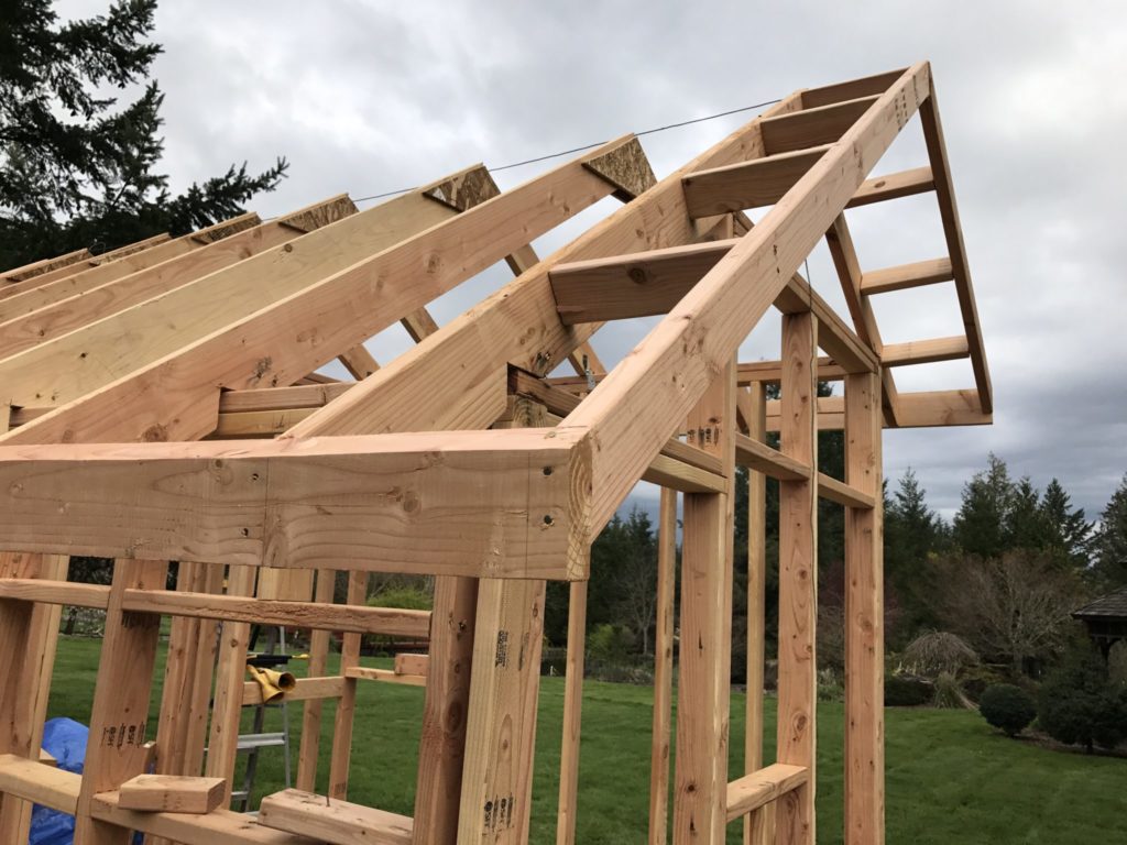 How far should Roof sheathing overhang fascia?