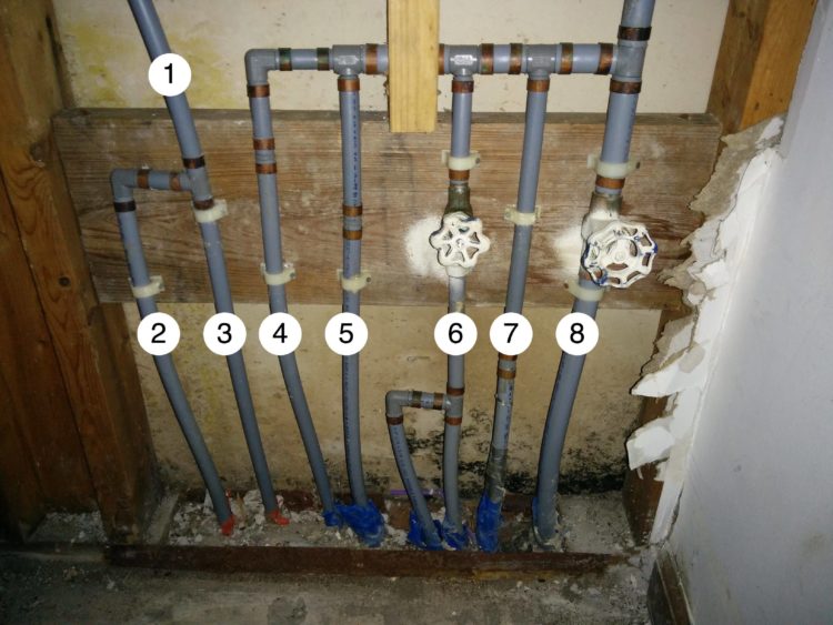 Where are the water pipes in a slab house?