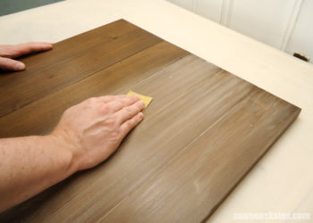 Should I sand between stain and poly?