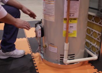 How do you install a drip pan on a hot water heater?