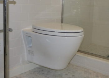 How do you fit a toilet hanging on the wall?