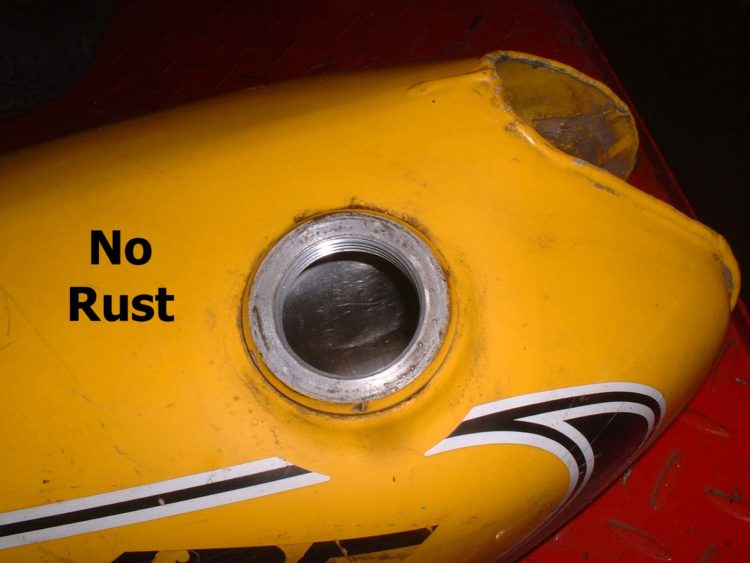 How do you fix a rusty motorcycle gas tank?