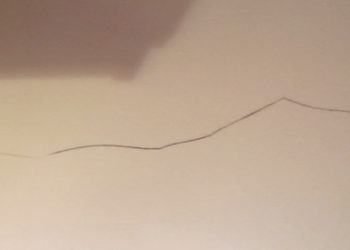 How do you repair a hairline crack in a Corian countertop?