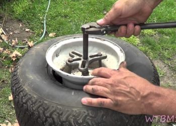 How do you change the wheels on a Troy Bilt lawn mower?