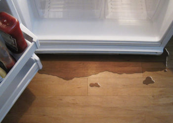 why is my fridge leaking water