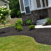 Is black mulch better than Brown?