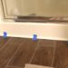 How do you finish vinyl flooring around a bathtub?