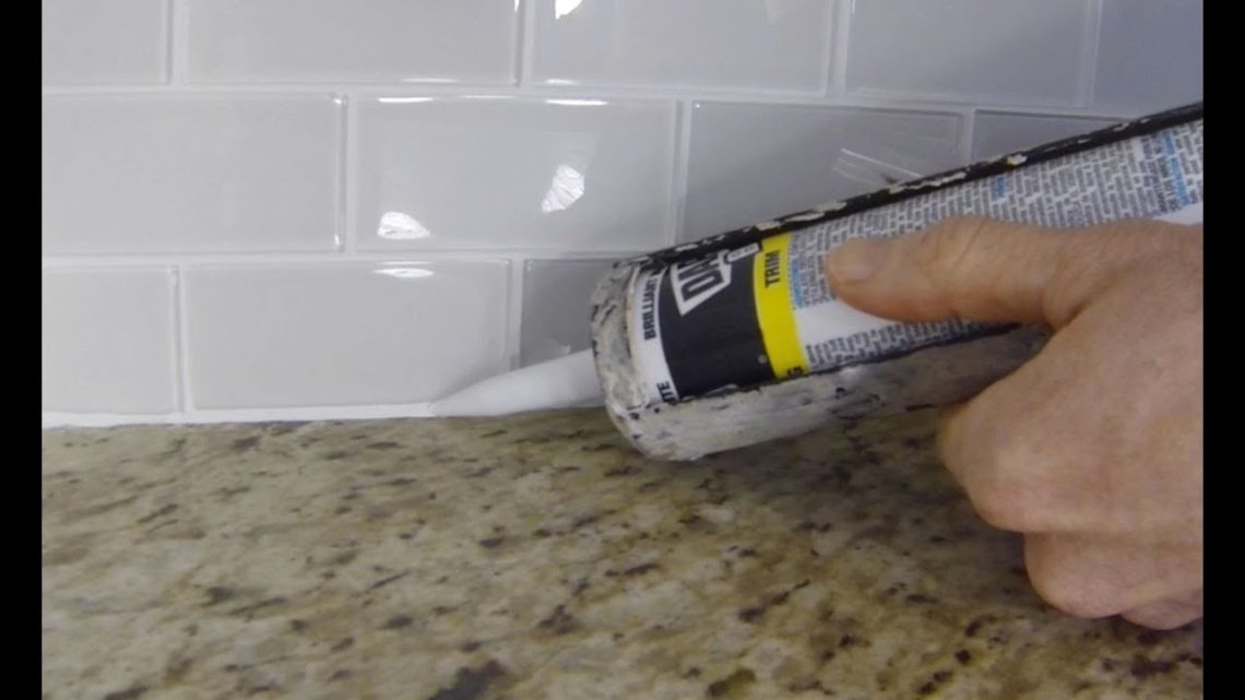 Should I caulk between countertop and backsplash?