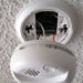 How do you stop a hardwired smoke detector from going off?