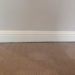 how much gap under baseboard for carpet