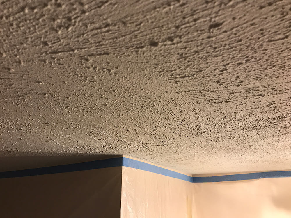 skim coat over popcorn ceiling cost