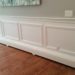 Can you cover baseboard heater with wood?