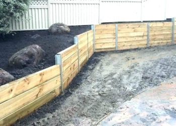 What is the cheapest way to build a retaining wall?