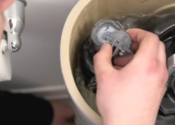 How do you stop a toilet tank from hissing?