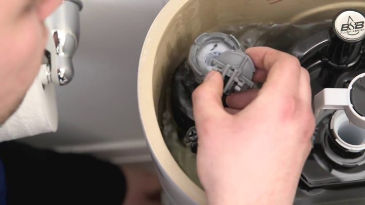 How do you stop a toilet tank from hissing?