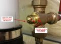 How do you adjust an anti scald valve?