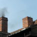 black smoke coming out of chimney