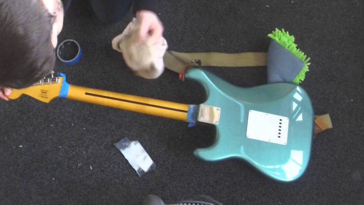 sanding paint off guitar