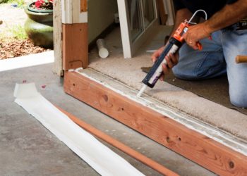 How do you replace a sliding glass door threshold?