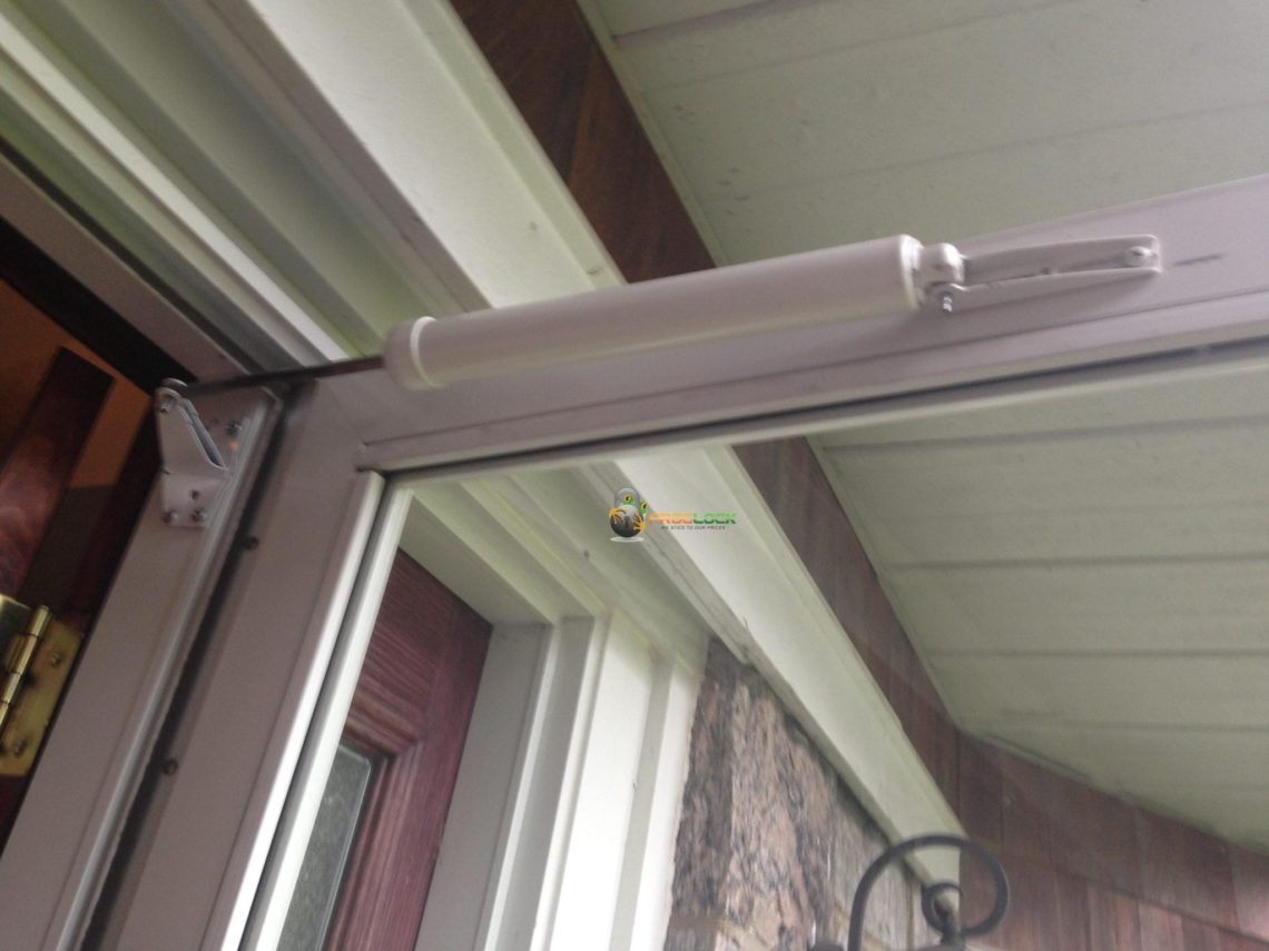 Where do you hang a storm door closer?