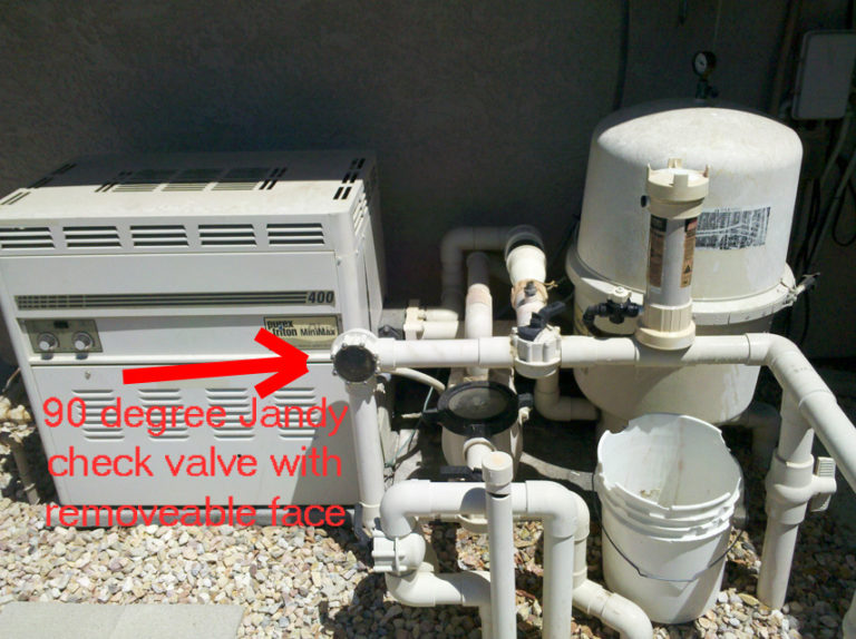 Where should a pool check valve be installed?