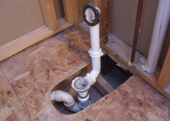 How do you install a slip fit shower drain?