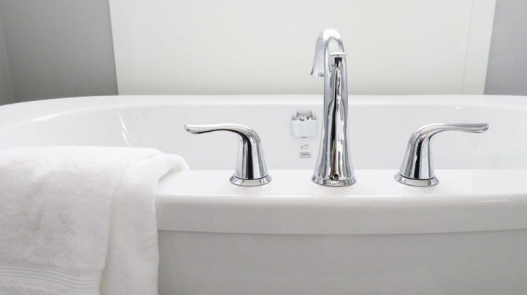 Why does my toilet bubble when I drain the bathtub?