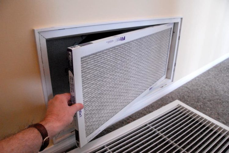 How do I clean the filter on my Kenmore window air conditioner?