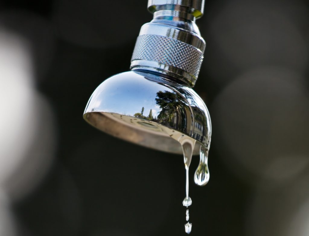 Why is my shower head dripping water?