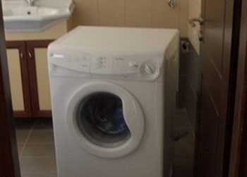 How do you fix an unbalanced washing machine?