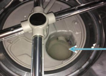 Why is there standing water in my GE dishwasher?