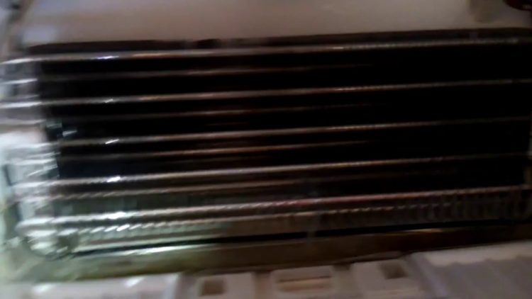 How do you unclog a refrigerator drain?