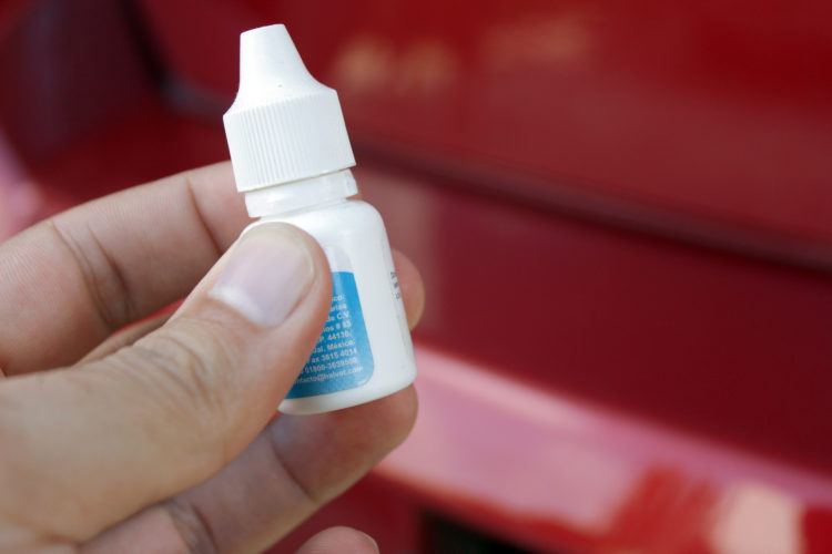 how to remove super glue from paint on a car