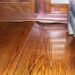 what causes a wood floor to buckle